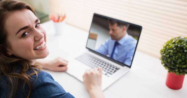 istock Woman having video call on laptop. 1266986400