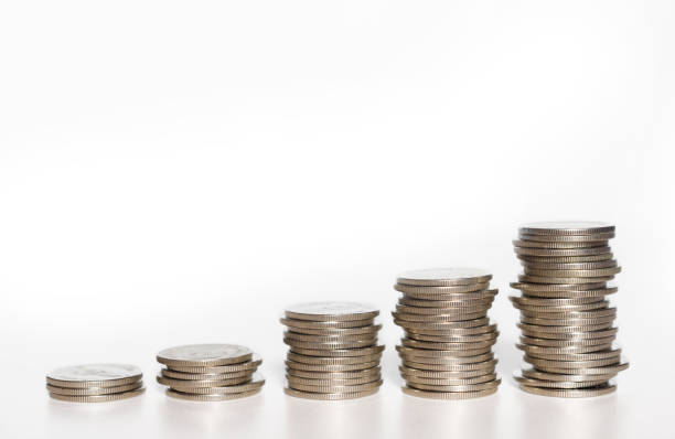 istock silver coin stack growth up isolated on white background with clipping path. money saving, financial grow, business startup, economy budget and investment concept. 1266986592