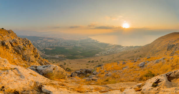 Panoramic sunrise view of the Sea of Galilee from Arbel stock photo
