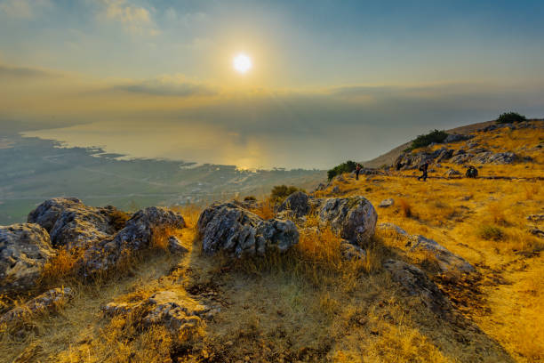 Sunrise view of the Sea of Galilee, from mount Arbel Arbel, Israel - August 14, 2020: Morning view of the Sea of Galilee, from mount Arbel, with visitors. Northern Israel galilee photos stock pictures, royalty-free photos & images