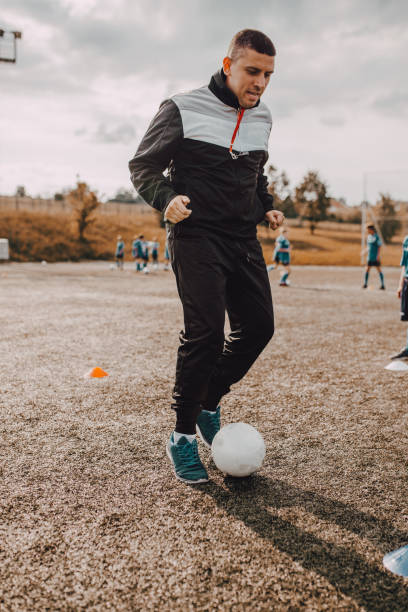 istock Coach and Young Footballers 1266990467