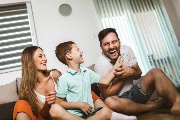 istock Young family being playful at home 1266991684