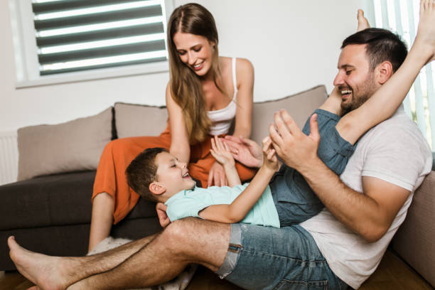 istock Young family being playful at home 1266991769