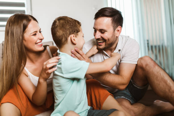 istock Young family being playful at home 1266991875