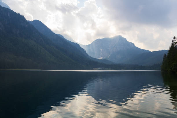 istock Nice sun rays over Vorderer langbathsee lake in Austria Alp mountain 1266992190
