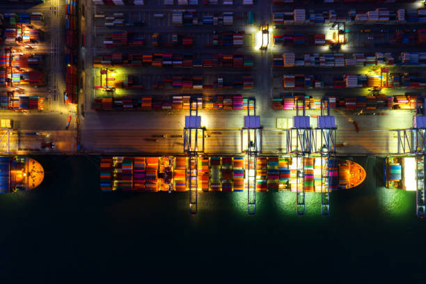 istock Container , container ship in export and import business and logistics. Shipping cargo to harbor by crane. Water transport International. Aerial view and top view. 1266993325