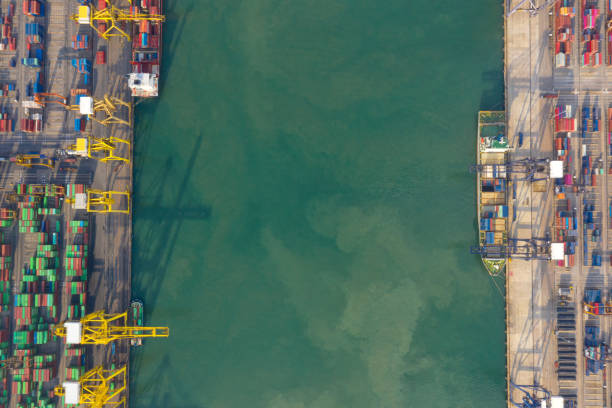 istock Container , container ship in export and import business and logistics. Shipping cargo to harbor by crane. Water transport International. Aerial view and top view. 1266993343