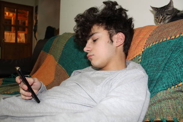 istock Young  man and  his  cellphone 1266994298