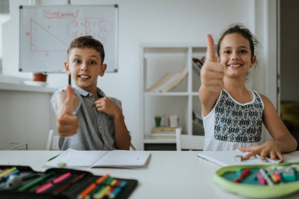 istock Satisfied kids are showing thumbs up 1266996908
