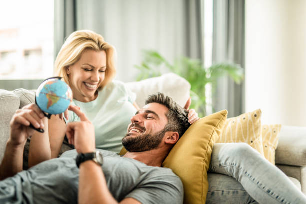 Happy young couple planning their new trip.
