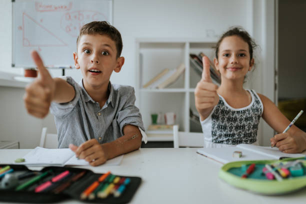 istock Satisfied kids are showing thumbs up 1266999715