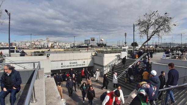 Eminönü, İstanbul - Turkey 31 February 2019 : Eminonu New Mosque and steps leading to underpass. \nGalata bridge is seen ahead