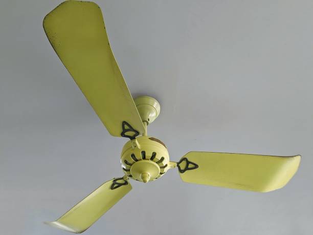 istock yellow ceiling fan in Vietnam 1267001126