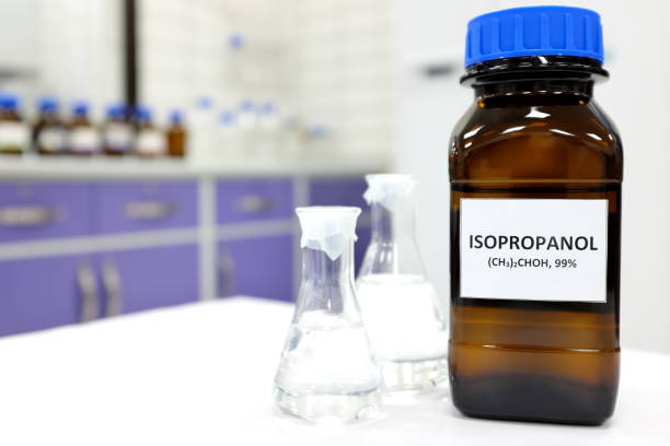 istock Selective focus of isopropanol brown amber glass bottle inside a laboratory. Blurred background with copy space. 1267001396