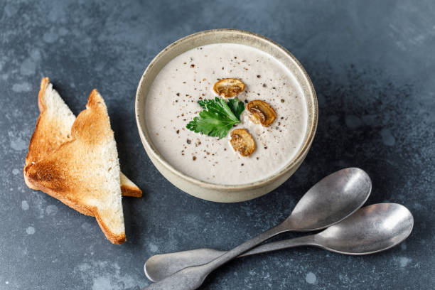 istock Mushroom cream soup on dark background. Mushroom soup 1267002592