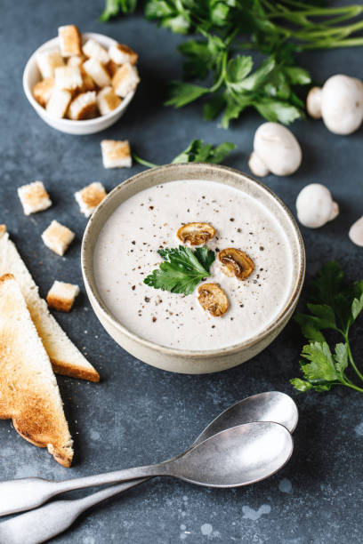 istock Mushroom cream soup on dark background. Mushroom soup 1267002601