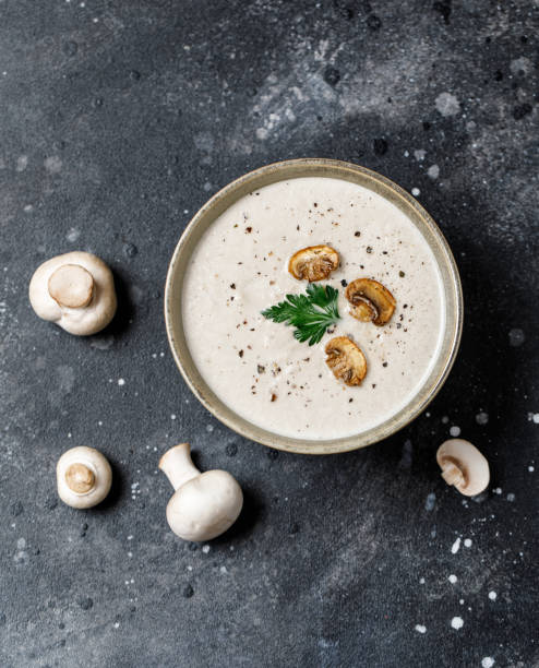 istock Mushroom cream soup on dark background. Mushroom soup 1267002611