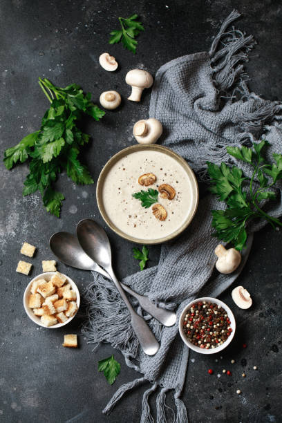 istock Mushroom cream soup on dark background. Mushroom soup 1267002671