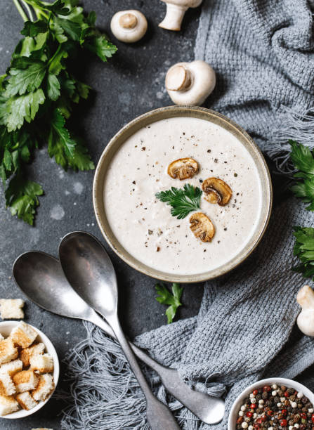 istock Mushroom cream soup on dark background. Mushroom soup 1267002680