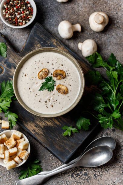 istock Mushroom cream soup on dark background. Mushroom soup 1267002701