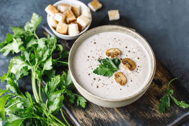 istock Mushroom cream soup on dark background. Mushroom soup 1267002755