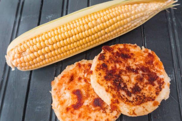 istock Corn arepas next to an ear of corn. Colombian cuisine 1267004367