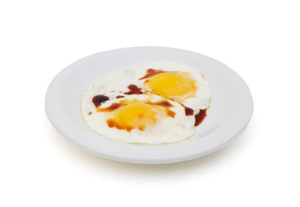 istock fried eggs in the place with soybean sauce on white 1267004661