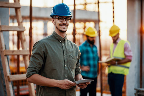 istock Portrait of group of engineers and architects on construction site 1267010755