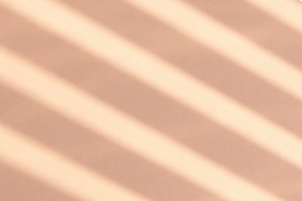 istock reflection of strips of blinds on a pastel background. Background with reflection 1267011957