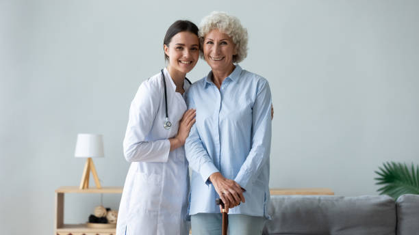 istock Happy physiotherapist ang disabled woman looking at camera. 1267012052