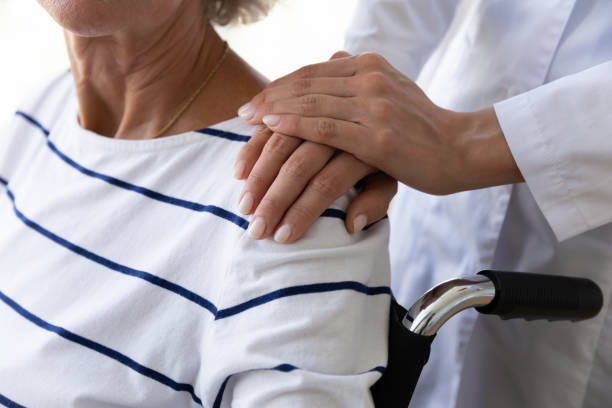 istock Young doctor giving psychological help to older disabled patient. 1267012064