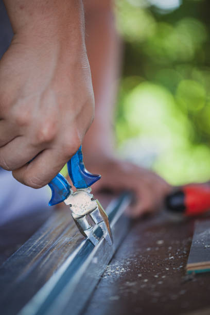 istock Man working with pliers like carpenter in his backyard 1267012185