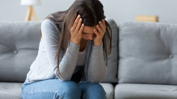 istock Frustrated young woman feeling depressed alone at home. 1267013585