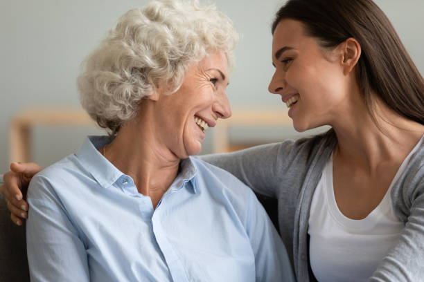 istock Smiling different female generations family enjoying conversation. 1267013592
