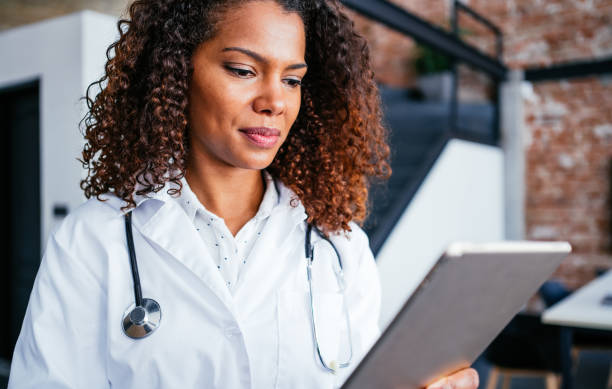 istock Portrait of a confident young doctor using a digital tablet. 1267013720