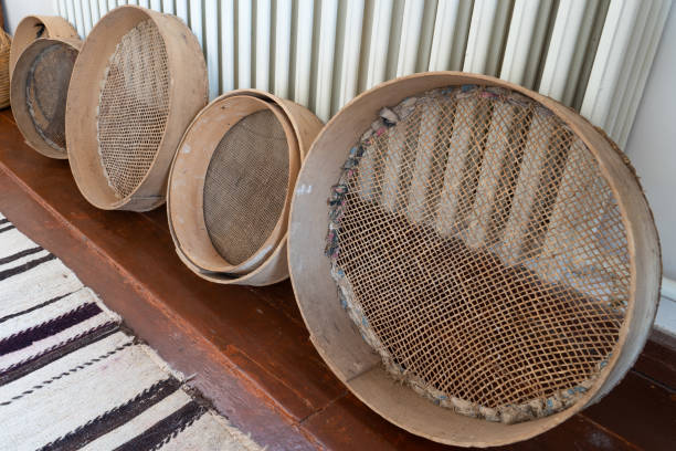 old rusty sieves in a row. - old fashioned domestic kitchen old close up imagens e fotografias de stock