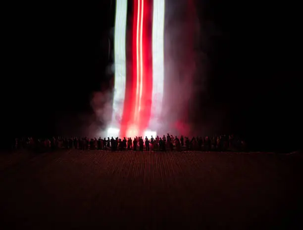 Belarus presidential elections protest. White and red colored light as symbol of Belarus flag. Creative artwork decoration. Crowd in dark. Selective focus
