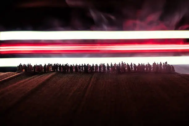 Belarus presidential elections protest. White and red colored light as symbol of Belarus flag. Creative artwork decoration. Crowd in dark. Selective focus