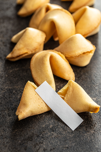 Chinese lucky cookies. Fortune cookies on black table.