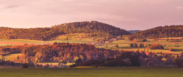 istock Hills bathed in the rays of the setting sun. 1267018816