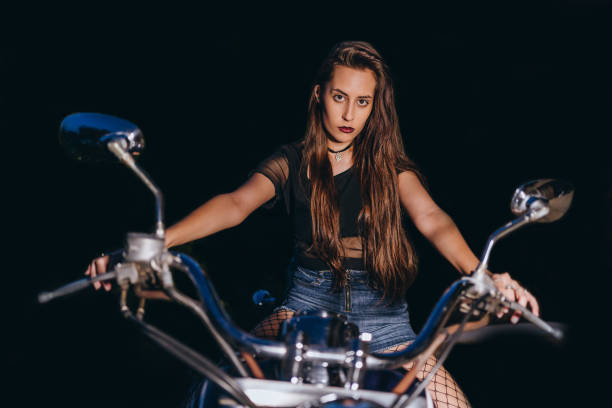 istock Biker woman on motorcycle 1267019017