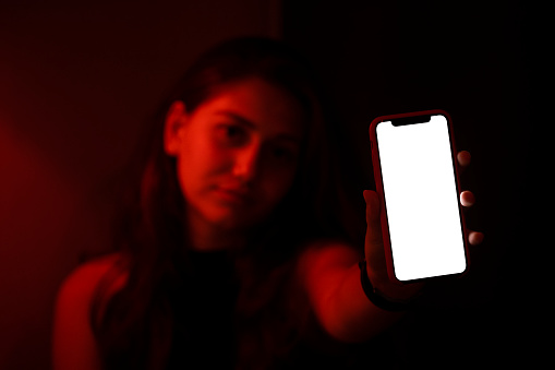 Woman showing a blank smart phone display