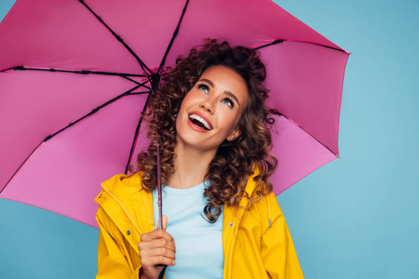 istock Girl with pink umbrella 1267021325