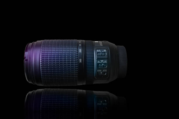 Frankfurt, Germany - November 19, 2008: Focusing technique effect over the Nikon Lens. Nikon is a Japanese multinational corporation headquartered in Tokyo, Japan, specializing in optics and imaging products.