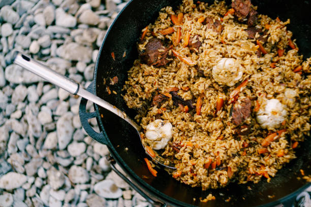 istock A close-up of a cast-iron cauldron with a ready-made pilaf. 1267024941