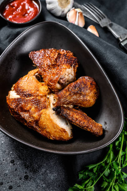 istock Peking style fried chicken. Black background. Top view 1267025930