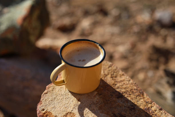 istock A close up image of a enamel coffee mug on a rock 1267025989