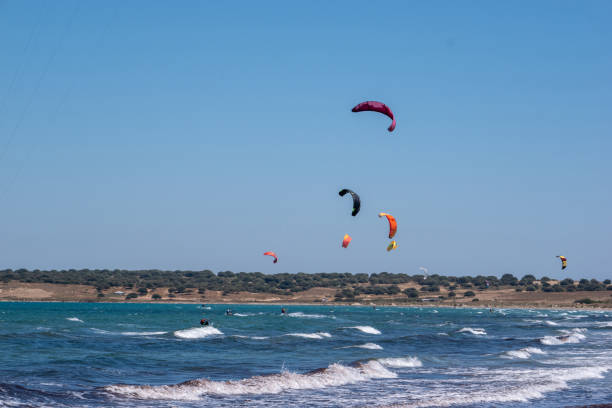 Group of kite surfers in a windy summer day, Gokceada, Turkey. Concept of extreme summer sports.