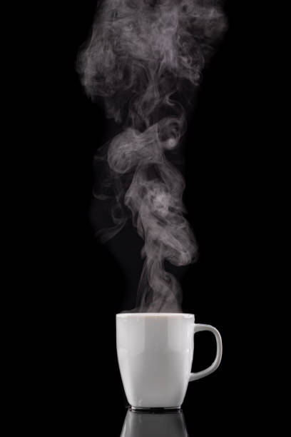 istock Coffee cup and steam. Freshly brewed coffee in a white ceramic mug. Dark background. 1267027789