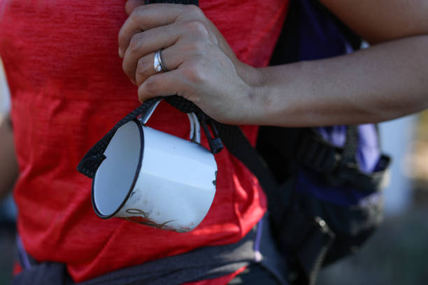 A close up image of an enamel coffee mug. stock photo